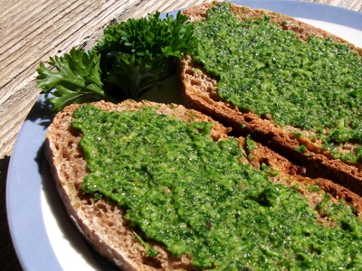 The parsley pesto can be served as a bread spread or to top pancakes, like a condiment in wraps, or spice up any salad or dip.  
