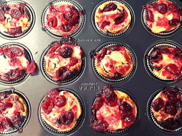 cherry muffins in the muffin pan
