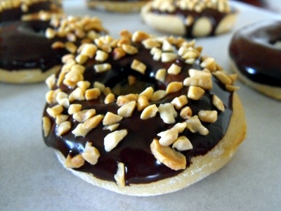 Baked doughnut with chocolate peanut topping