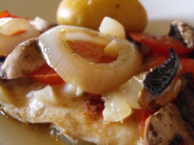 fish fillet with tomatoes and mushrooms