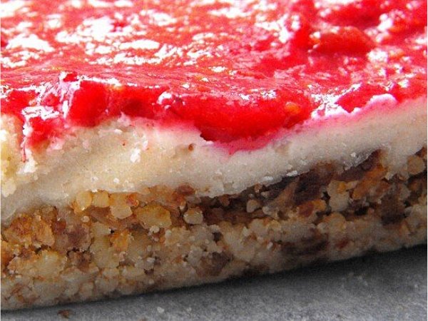 close-up, slice of three layered raspberry nut cake