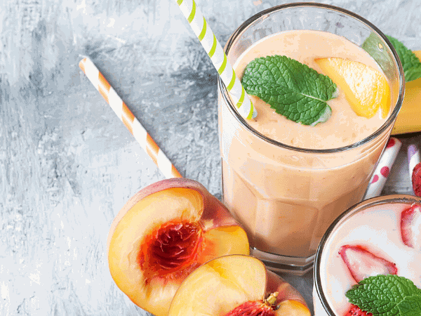 The banana peach smoothie recipe tastes best with sun-ripened raw peaches. The stone fruit is a good source for vitamin A and C. 